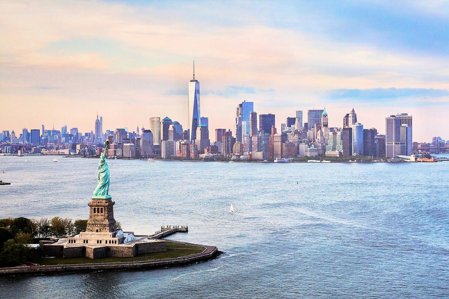 Beautiful custom artwork hand printed from premium materials.

This print of New York City features the Statue of Liberty, the Empire State Building, and the tallest of the skyline, One World Trade Center.