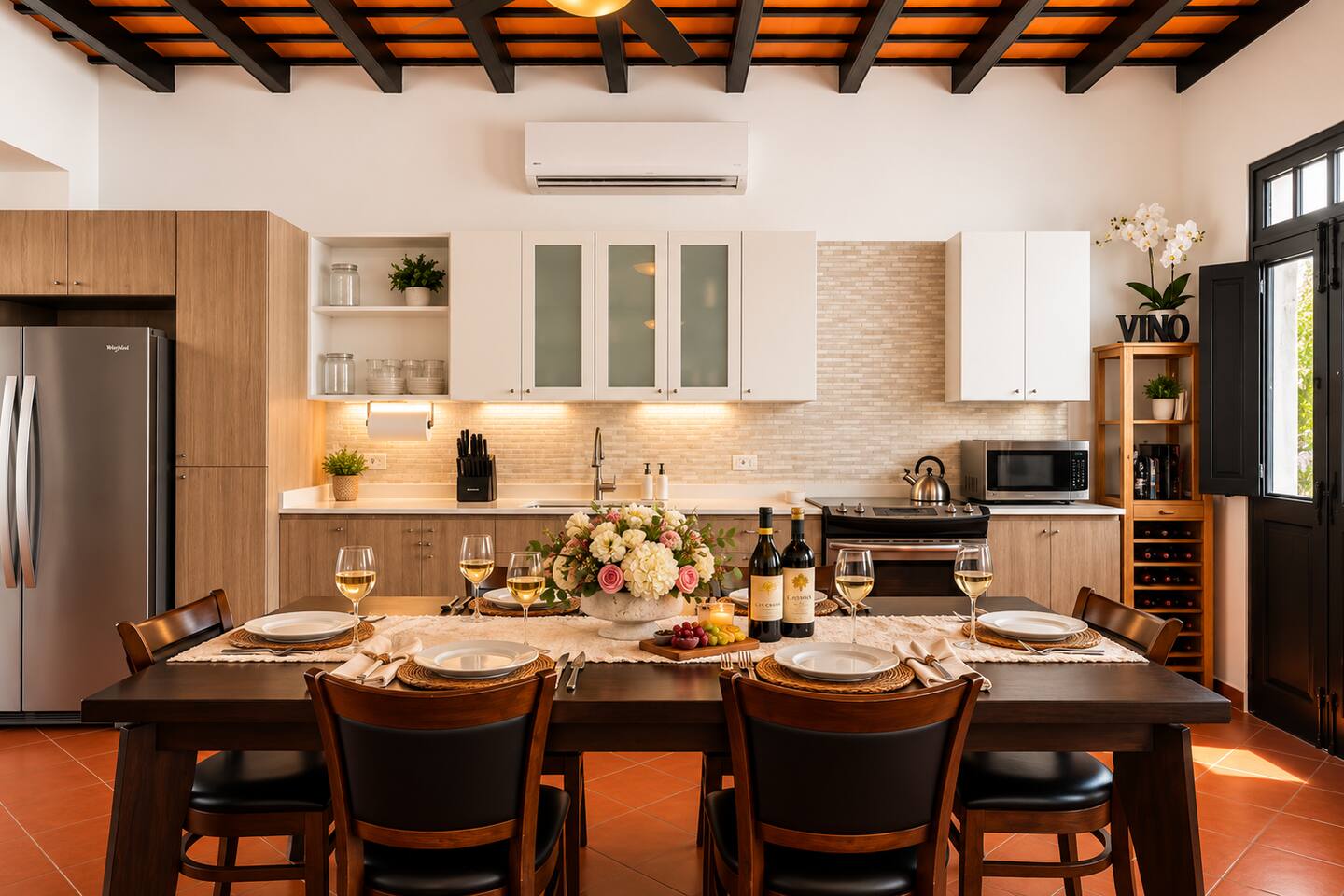Gather around the dining table for a memorable meal with family and friends. Our spacious, fully equipped kitchen and dining area seats eight comfortably, with modern appliances, warm wood finishes, and charming exposed-beam ceilings.