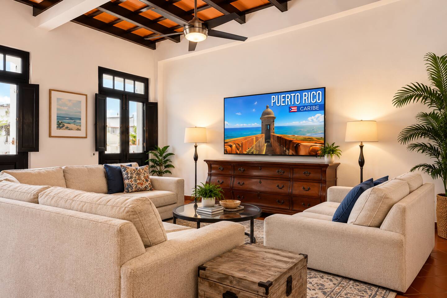 Kick back and relax in our spacious living room, featuring plush sofas, a large-screen Smart TV, and soaring ceilings with exposed wooden beams. The perfect gathering spot for movie nights or unwinding after exploring Old San Juan!