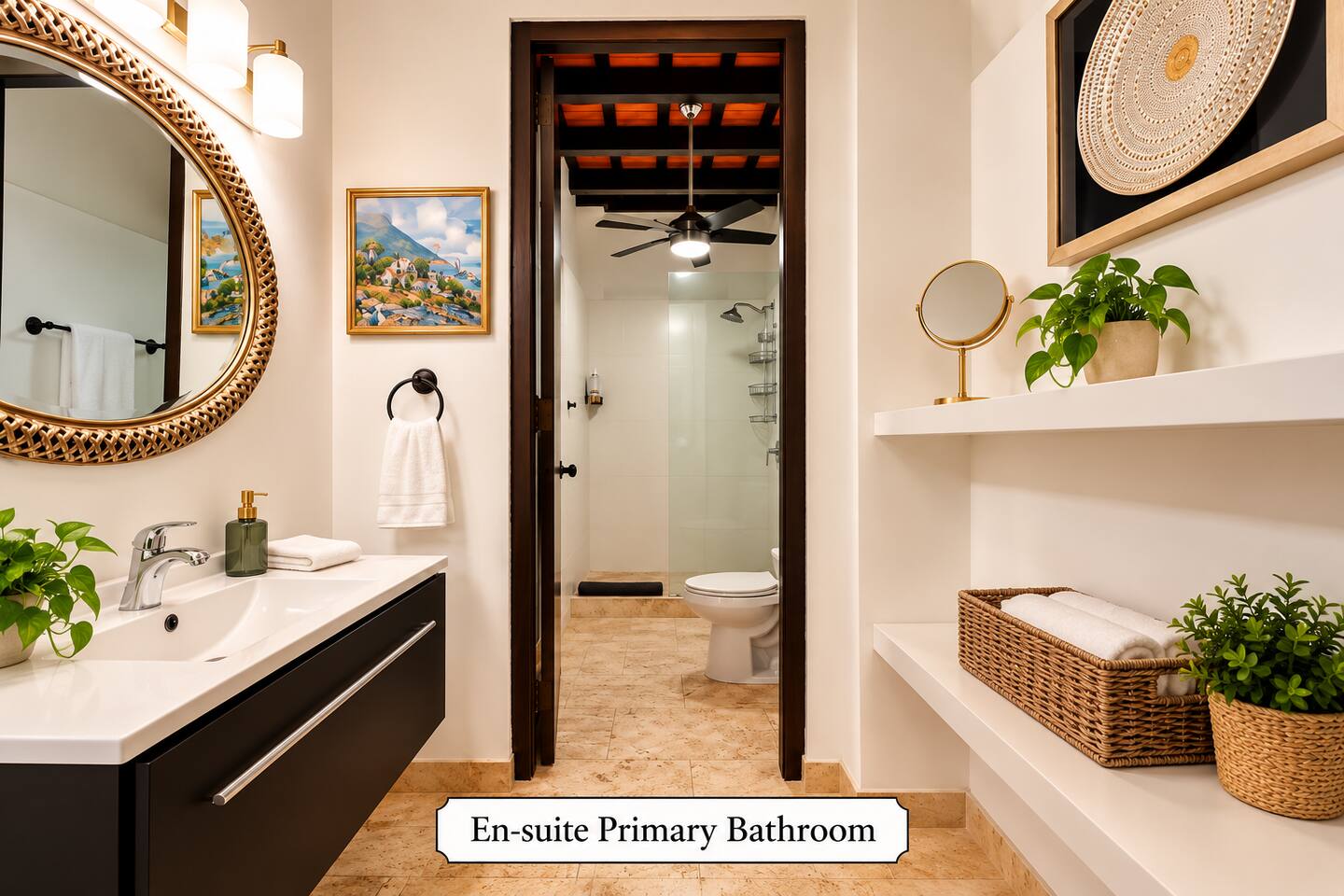 The primary en-suite bathroom features a spacious walk-in shower, sleek vanity, elegant gold-framed mirror, and warm lighting, blending modern comfort with Old San Juan’s historic charm.