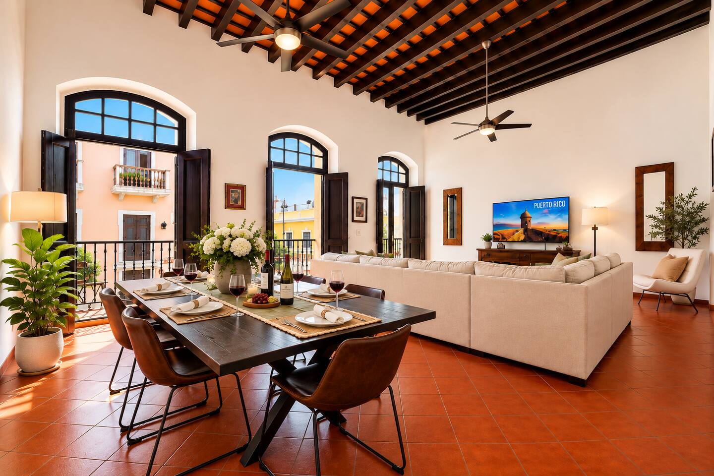 Gather with family and friends in this spacious, sun-filled living and dining area, where soaring ceilings, historic details, and charming Old San Juan views create the perfect setting for meals, lively conversations, and unforgettable memories.