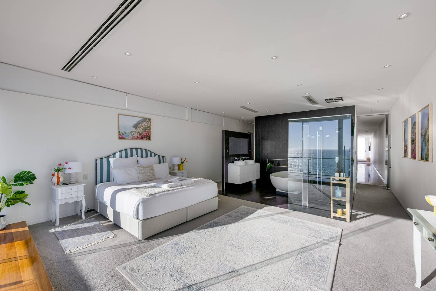 King bedroom with ensuite soaking tub and rain shower steps away