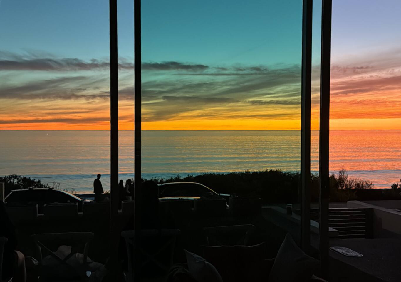 Sunset dinners framed by palms on the glowing horizon