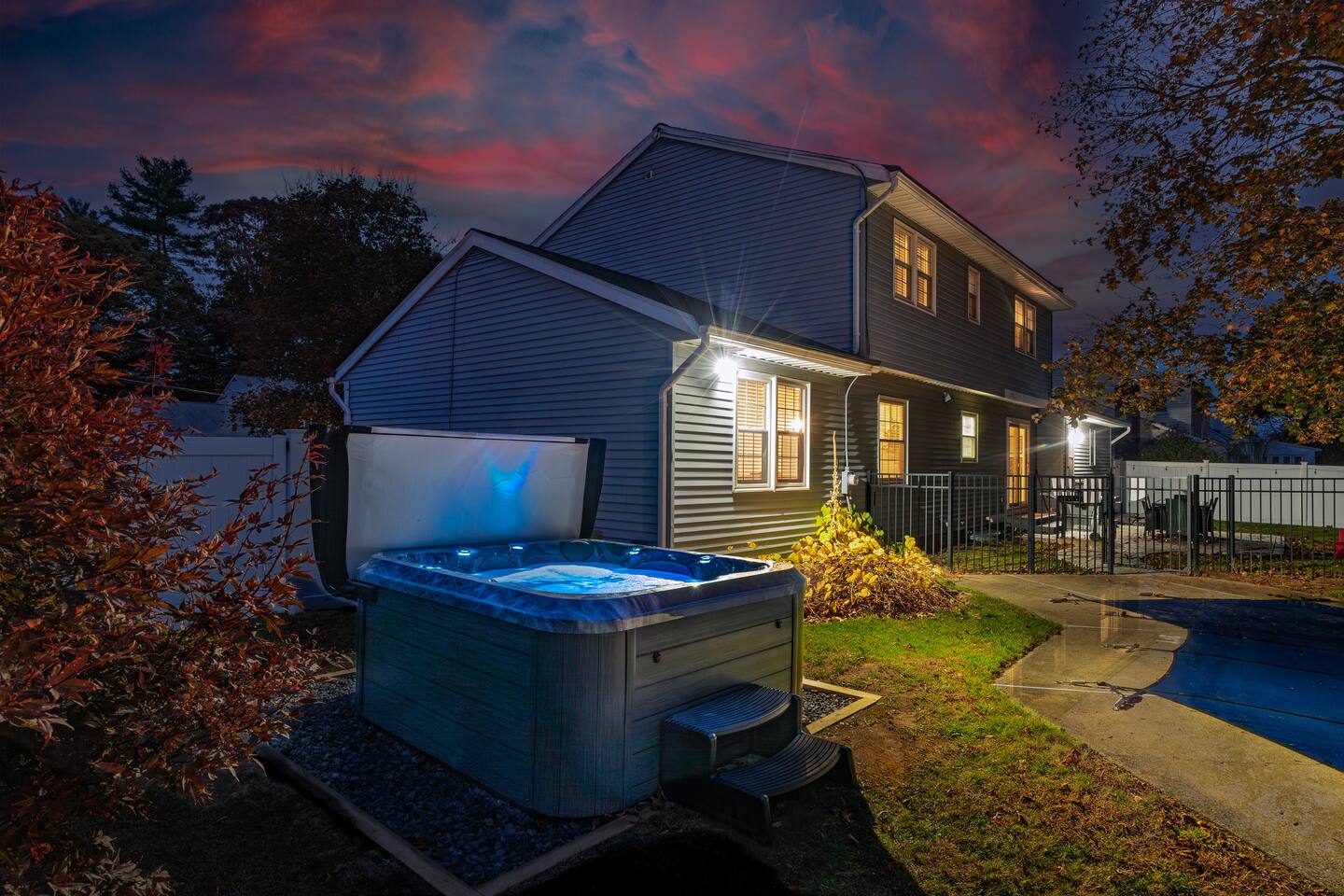 Walters Retreat backyard with a private hot tub and fire pit under the stars