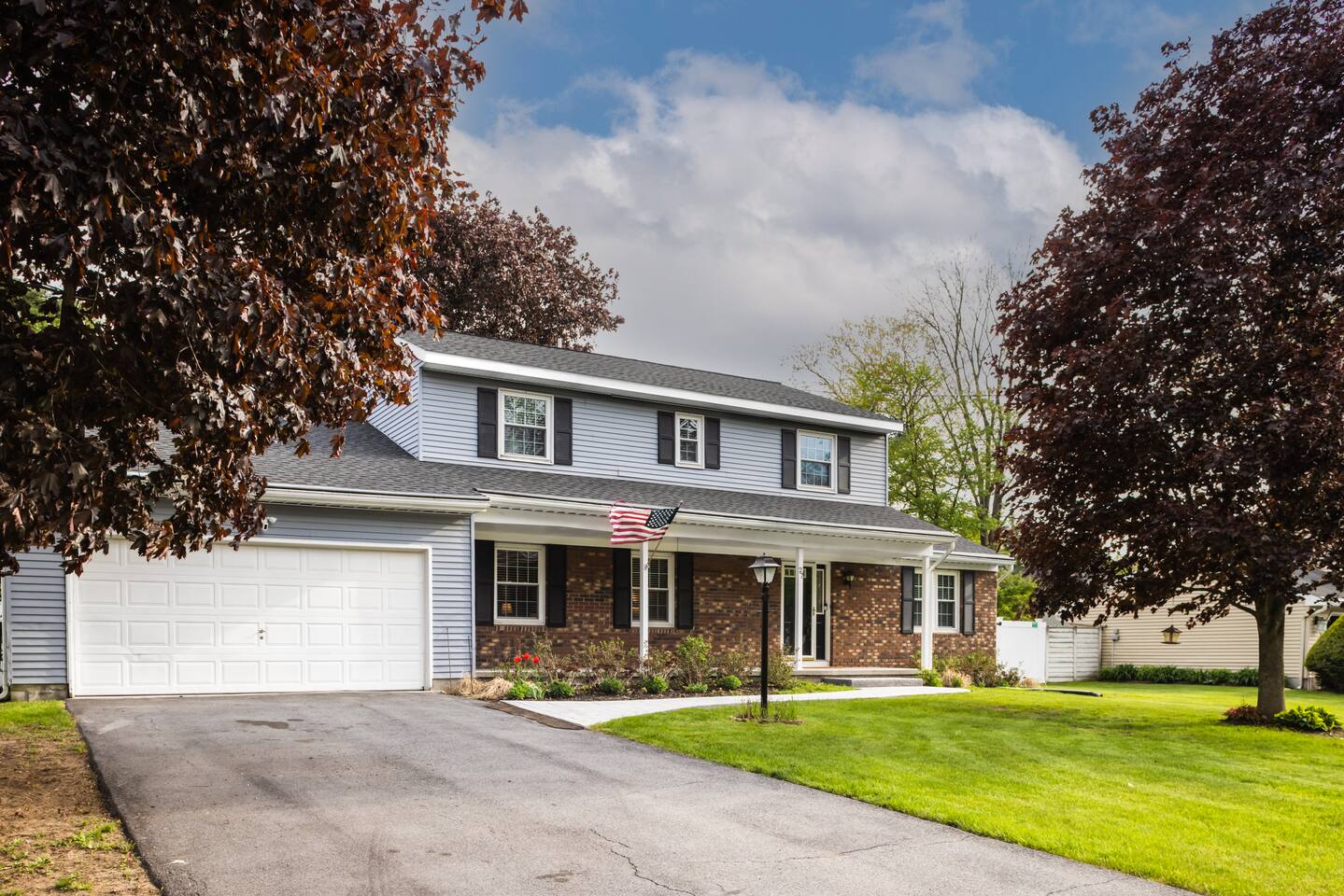 Colonial-style front of Walters Retreat with a welcoming porch